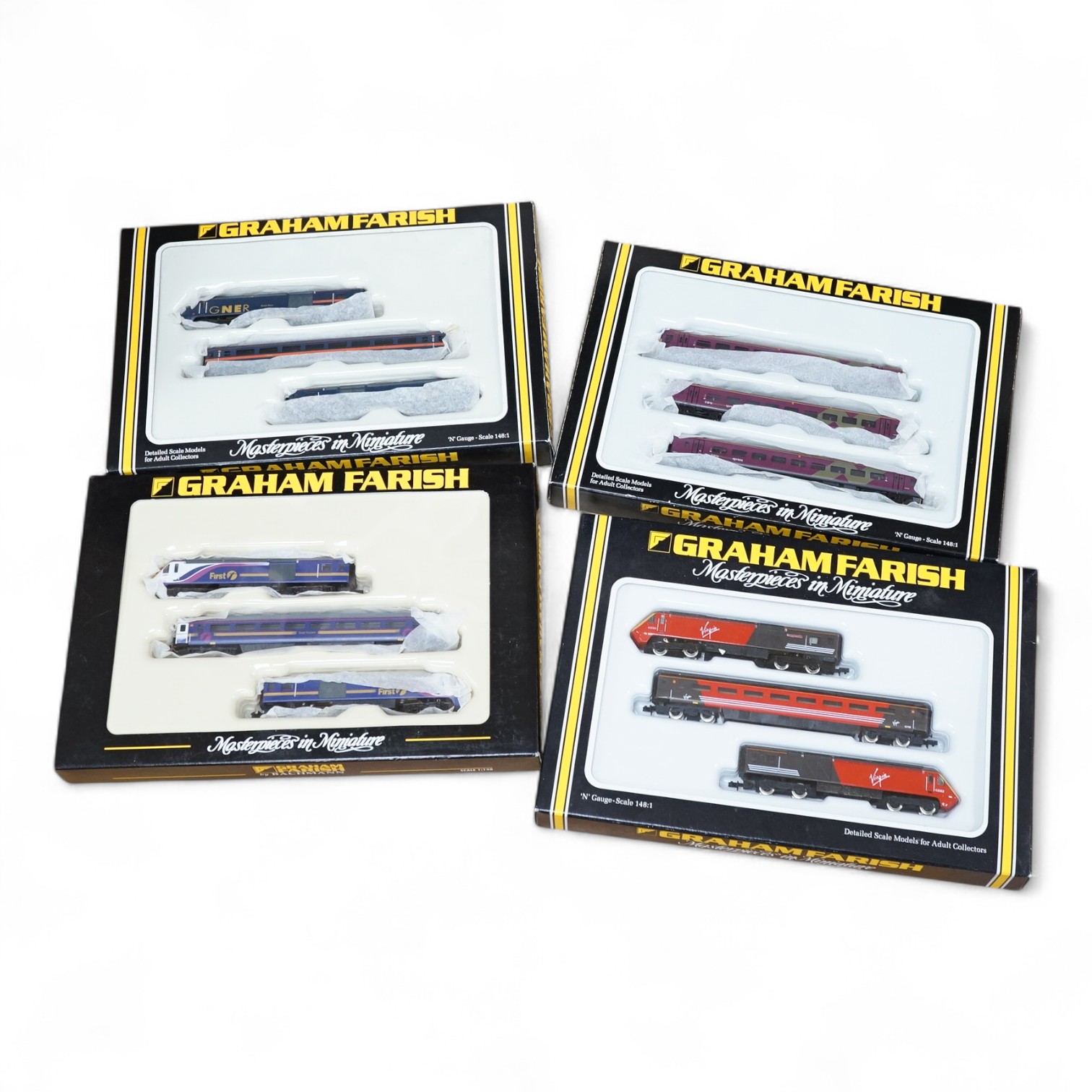 Four boxed Graham Farish N gauge railway train packs; a Virgin Trains HST 124 train (8128), a First Great Western HST 125 train (371477), a Northern Sprite 3-car DMU (371525) and a GNER HST 125 train (371476). Condition